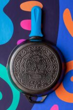Lodge 10.25 Inch Pre-Seasoned Cast Iron Stamped Skillet Electric Blue Silicone Hot Handle Holder - Reusable Heat Protection Up to 500° - Sugar Skull - Image 3