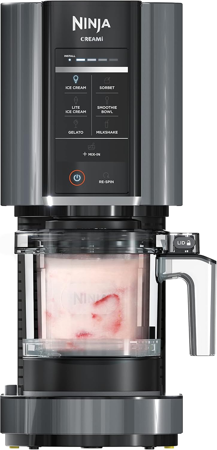 Ninja-CREAMi-Ice-Cream-Maker-7-in-1-IceCream-Gelato.jpg Ninja CREAMi Ice Cream Maker | 7-in-1 - IceCream, Gelato, Sorbet, Milkshakes, Mix-ins, Smoothie Bowls & More | Includes (1) Dishwasher Safe 16 oz. Pint with storage lid | Black | NC299AMZ - Image 1