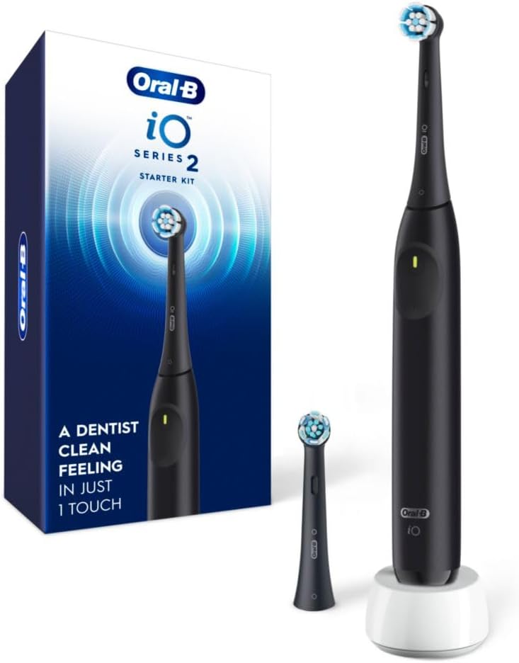 Oral-B-Rechargeable-Electric-Toothbrush-iO2-Starter-Kit-3-Cleaning-Modes.jpg Oral-B Rechargeable Electric Toothbrush, iO2 Starter Kit, 3 Cleaning Modes, Automatic Pressure Sensor to Protect Gums, 2 Brush Heads, Night Black - Image 1
